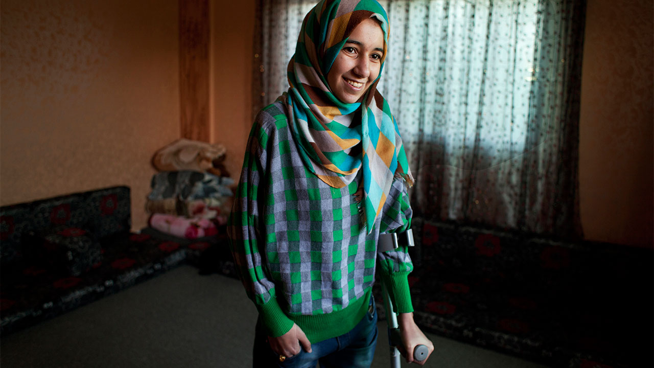 Roqaya, who lost both her legs in a bombing on Syria; }}