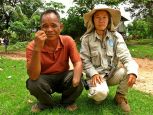 Lumngen with Eian, a cluster munition survivor, Laos. ; }}