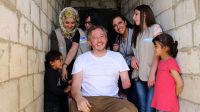 Giles Duley with Bana (left), her sister, and the HI rehabilitation team in Lebanon.; }}
