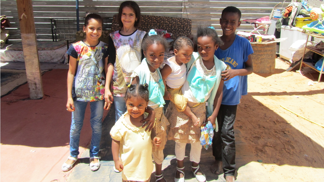 Group of children from displaced families in the suburbs of Tripoli.; }}