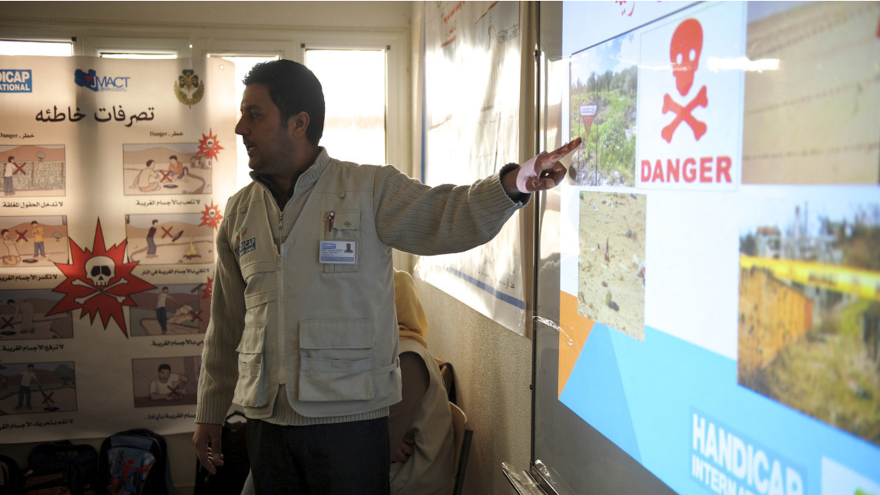 A risk education session in a school, Handicap International Libya; }}