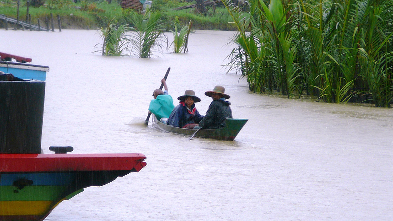 This photo of residents in the village of Kun Thee Chaung was taken during previous flooding, caused by Cyclone Nargis in 2008. Myanmar.; }}