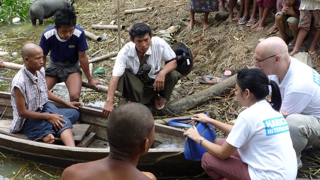 Eric Weerts and the Handicap International team conduct a situation assessment for a person with disabilities who needs to use a boat to reach his home from the road due to the floods. Myanmar; }}