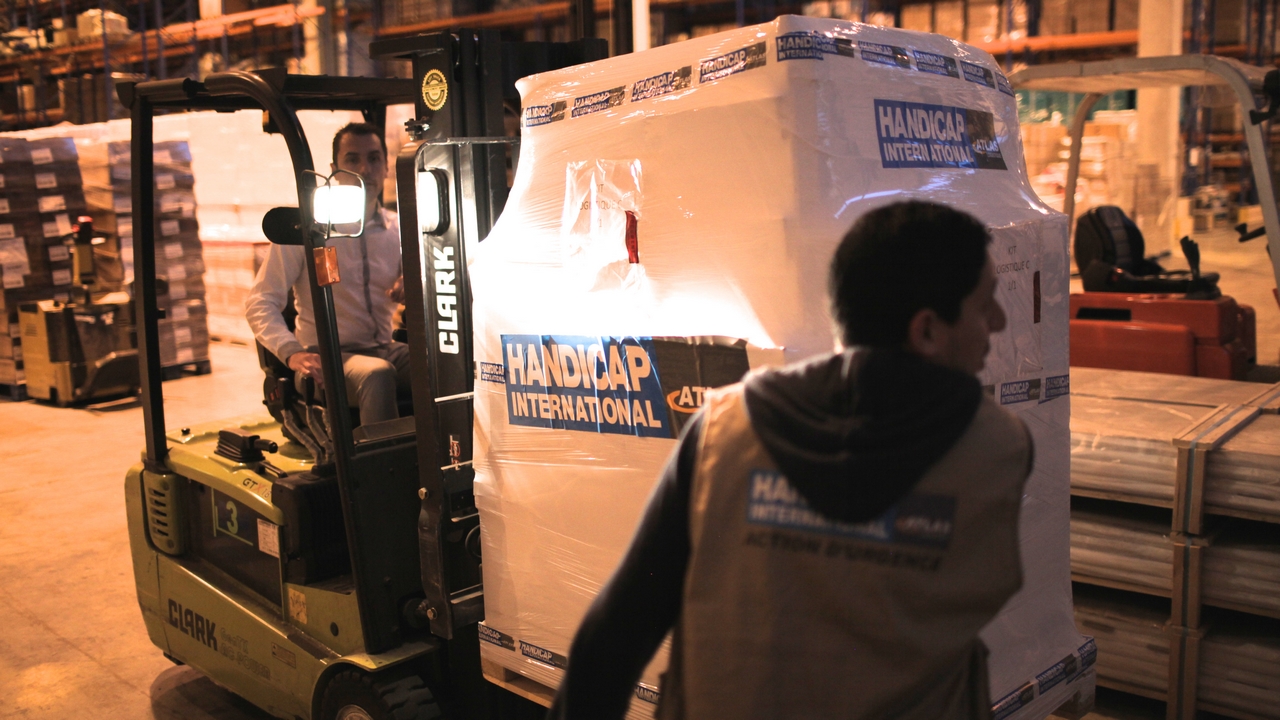 Norredine Zenati supervising the loading of emergency stock to be sent to Nepal to support our emergency response.; }}