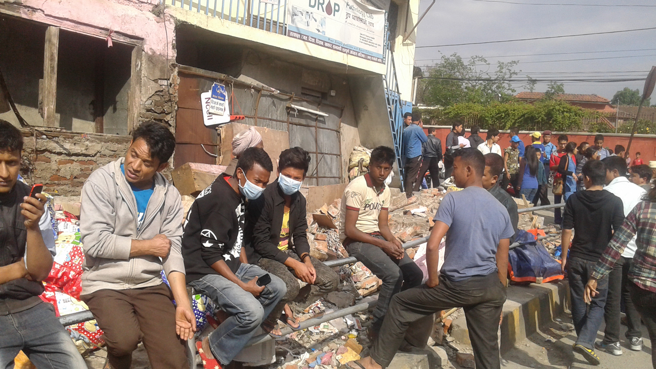People waiting outside in the immediate aftermath of the earthquake. Nepal.; }}