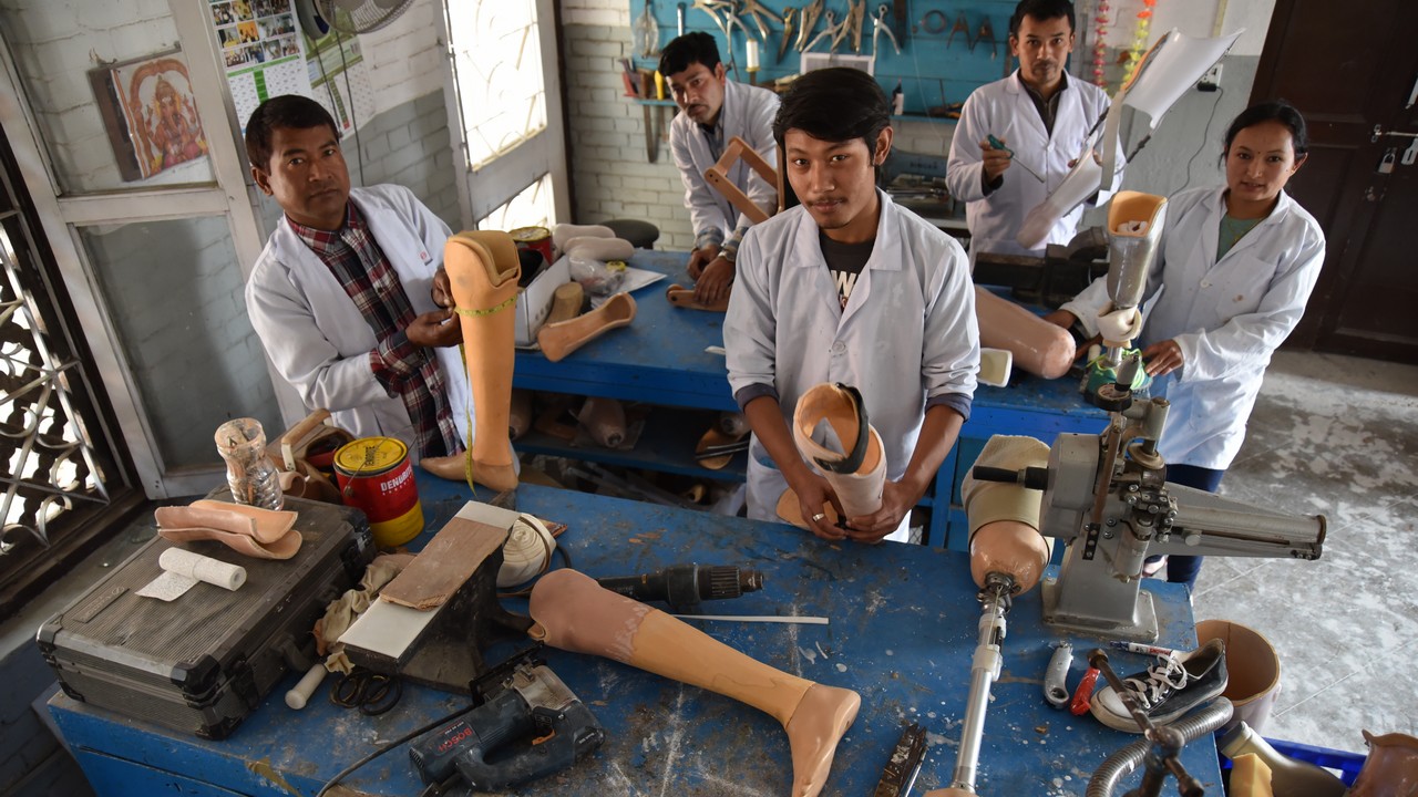 A prosthetics and orthotics workshop at the National Disabled Fund rehabilitation centre in Kathmandu, which is supported by Handicap International. Nepal.; }}