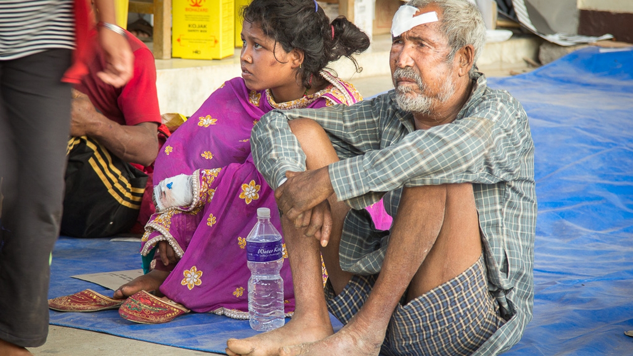 Injured people outside a hospital in Kathmandu during the aftershocks. Nepal.; }}