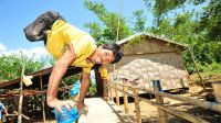 Roldan outside his new home. The Philippines. ; }}