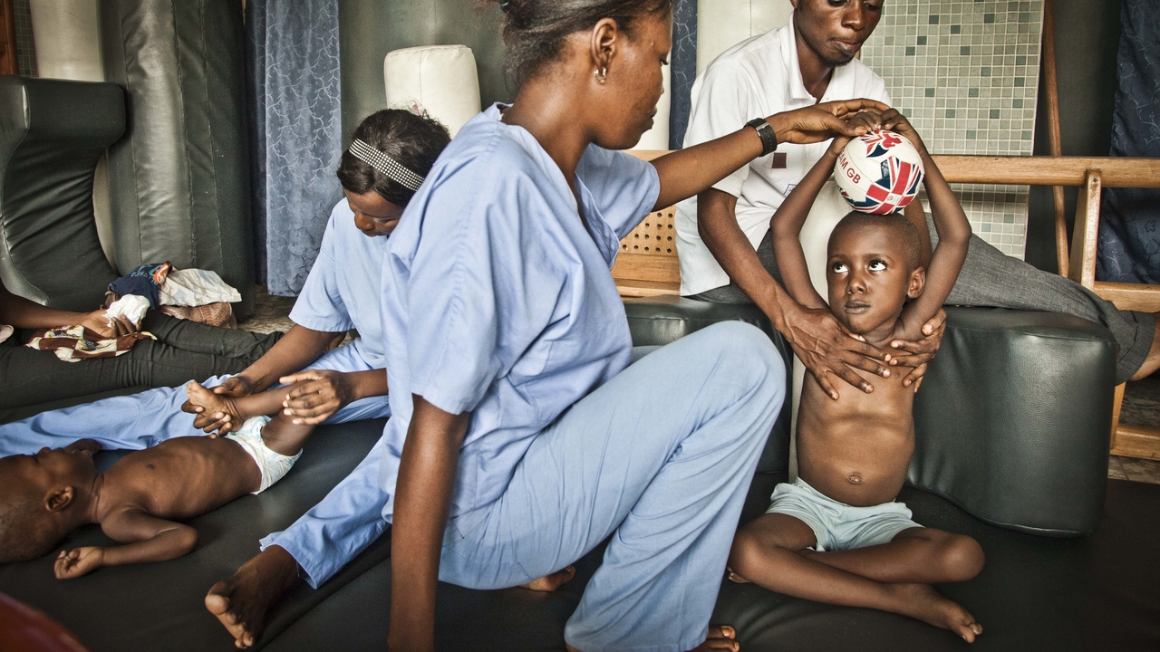 Archive image: physiotherapy session, Kinshasha, 2013          
