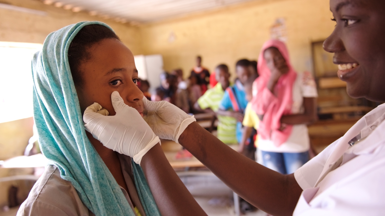 Adama Awa Ba, a twelve-year old school girl, undergoes a medical visit in a primary school in the Patte d’Oie district of Dakar.; }}
