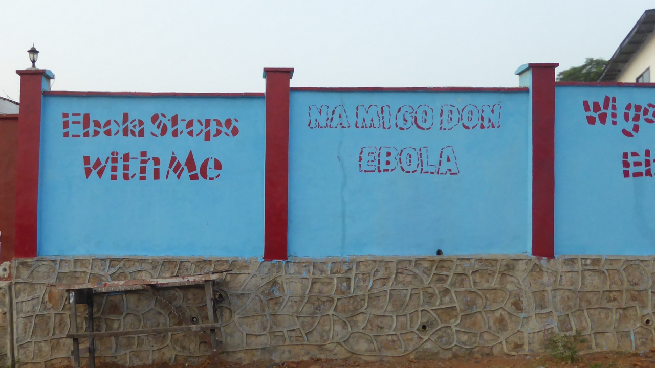 Ebola prevention messages painted on to a wall in Freetown, Sierra Leone.; }}