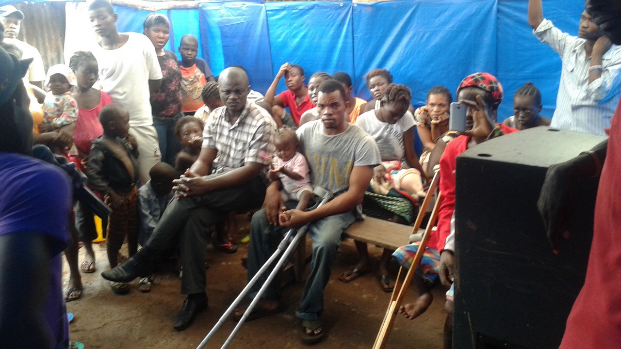 A Handicap International, ebola risk awareness session, delivered to give local redidents they need to minimize the risk of infection. Sierra Leone.; }}