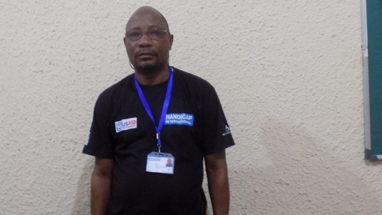 Sulu Bellarmin, who works as a driver and logistics assistant for Handicap International's team in Kasai, DR Congo.; }}