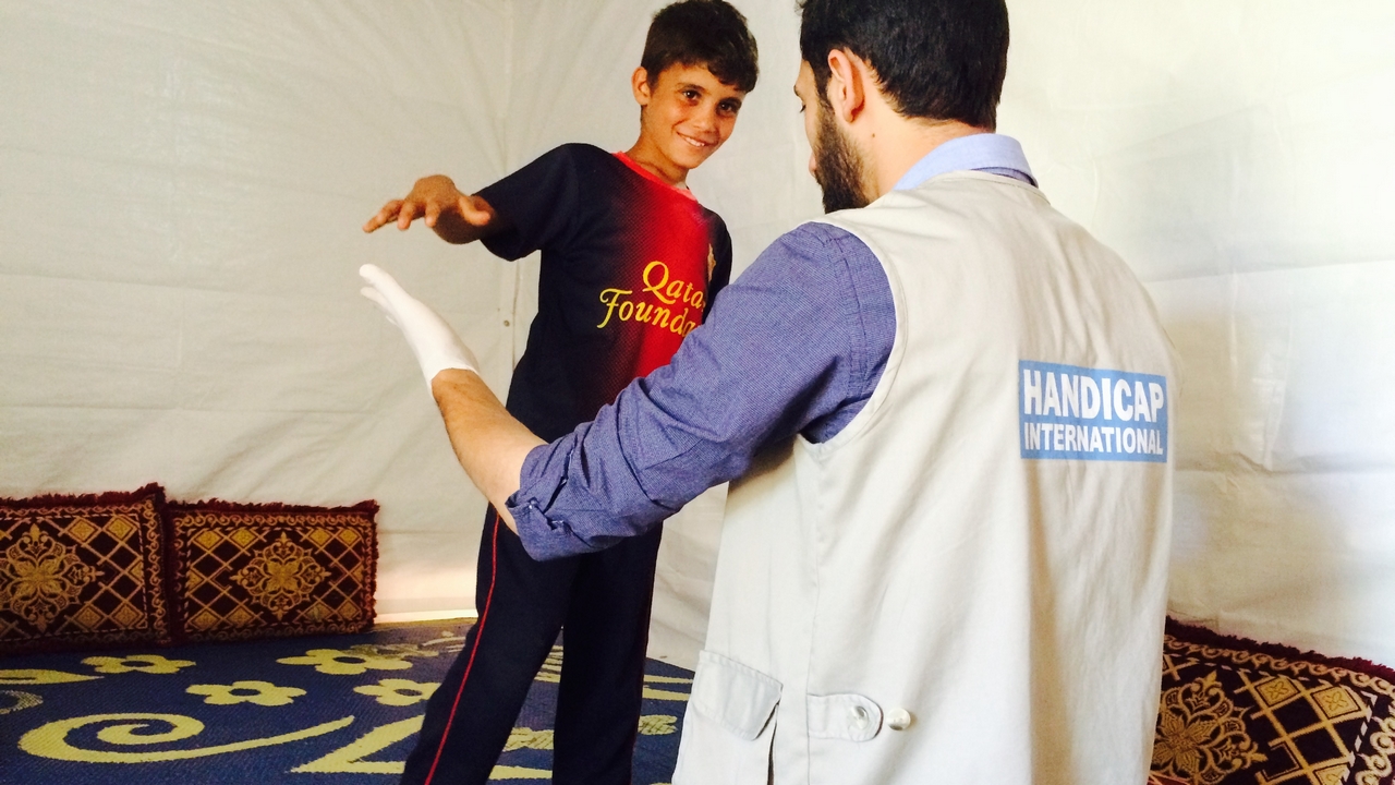 Mostafa, 8, in a physiotherapy session. Lebanon.; }}