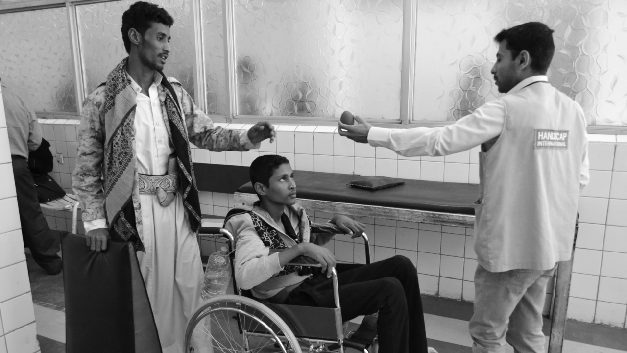  CALP hospital, Sana’a, in March 2017: Rehabilitation session with a tetraplegic patient injured during fighting in the north of Yemen.; }}