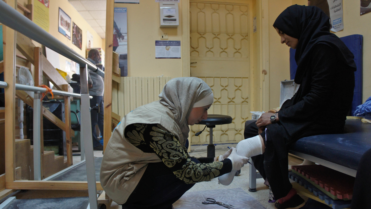  Aya takes Naayem’s measurements.; }}