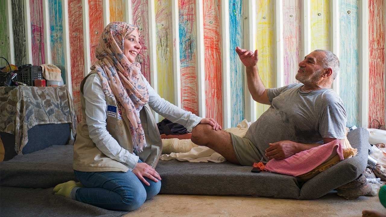  Rajab, 63, with Sally, an HI physiotherapist, in Azraq refugee camp, Jordan