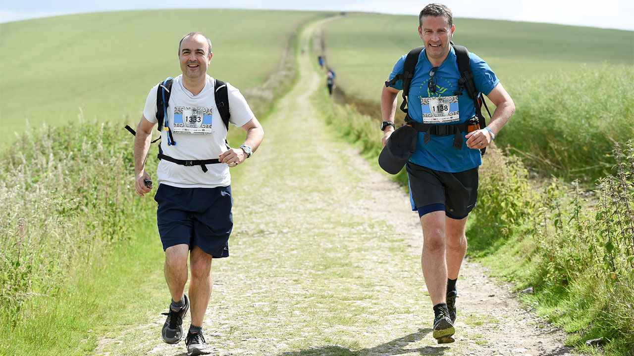 Rupert (right) and his running partner, Al, running the South Downs Way