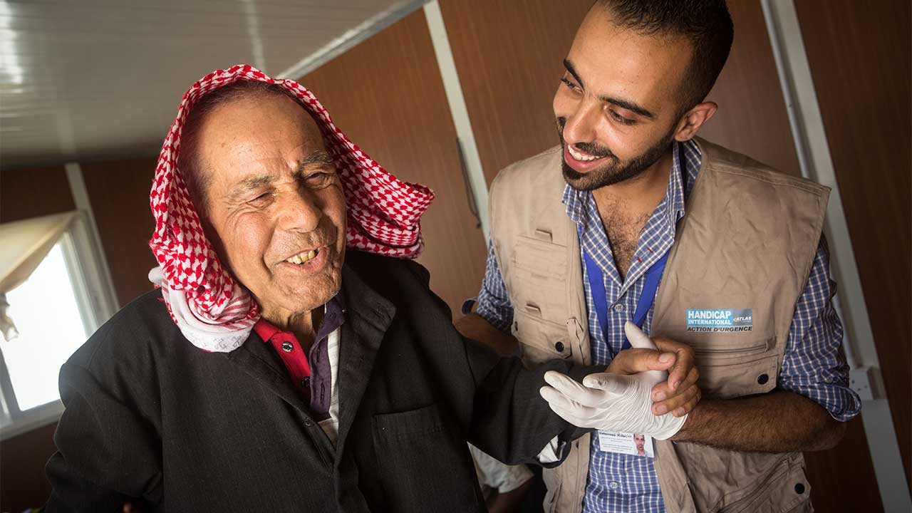 Jomaa, a 85 year old Syrian refugee, having a rehabilitation session.